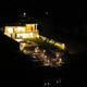 Modern home illuminated by outdoor sensor lights for contemporary homes at night.
