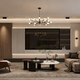 A stylish living room featuring a branch style chandelier, modern furniture, and elegant decor for contemporary aesthetics.