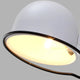 Close-up of a white light fixture with a glowing bulb, illustrating how to clean light fixtures for a brighter home.