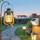 Elegant outdoor pathway lighting guide showcasing lanterns and solar lights illuminating a garden pathway.